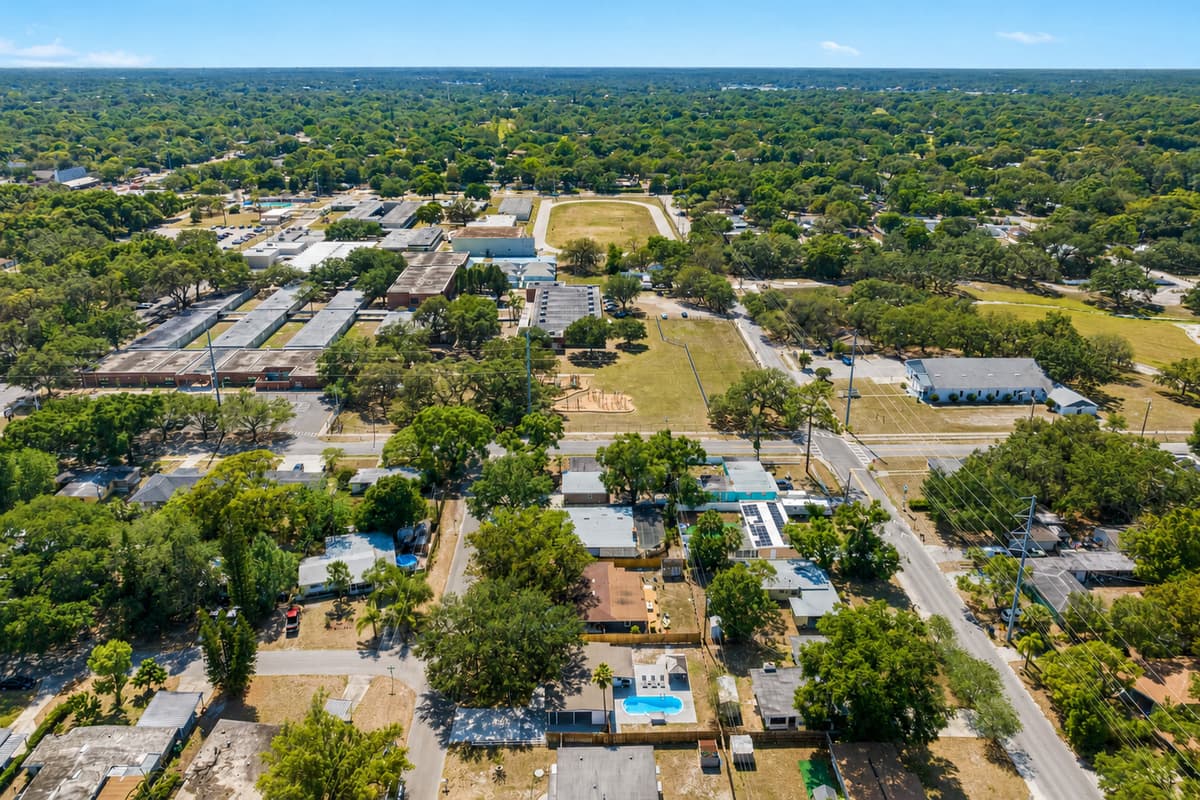 Beyond the property, the charming neighborhood unfolds, with winding roads and leafy