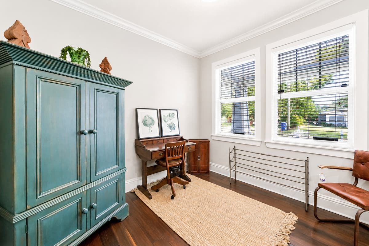 Stay productive with a dedicated workspace featuring a desk, ample natural light, and plenty of room to focus.