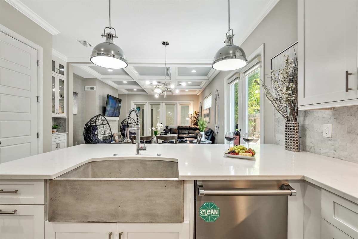 The gleaming countertops offer ample space for meal preparation, allowing you to unleash your culinary prowess with ease.