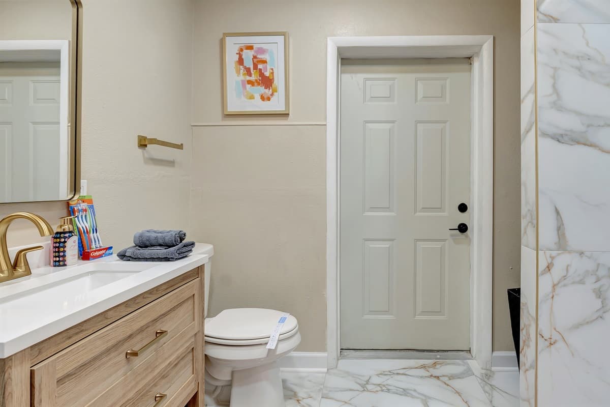 The lavish cream, marble, and gold combination exudes sophistication and luxury.