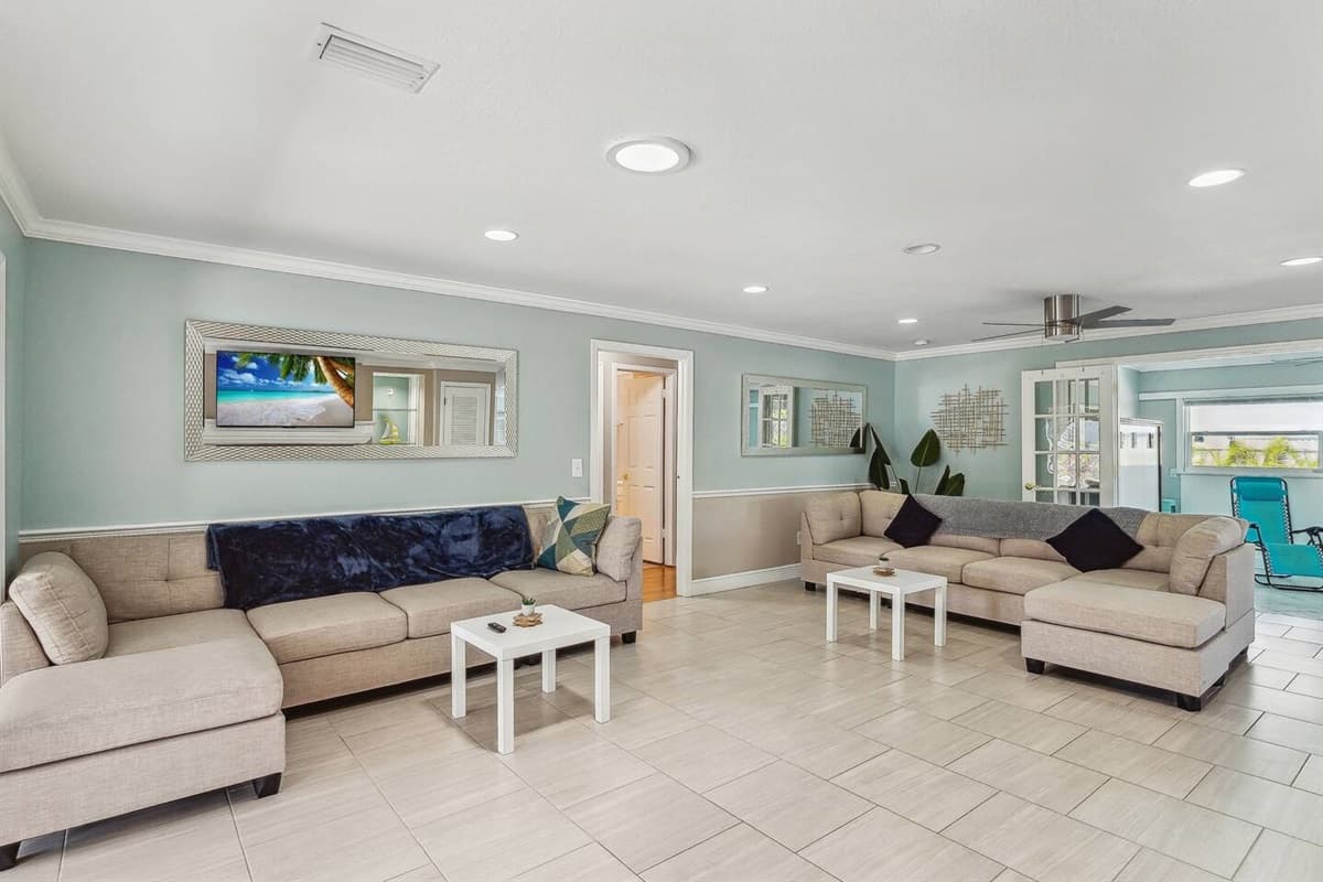 Living room with plenty of seating for the family and large UHD Smart TV