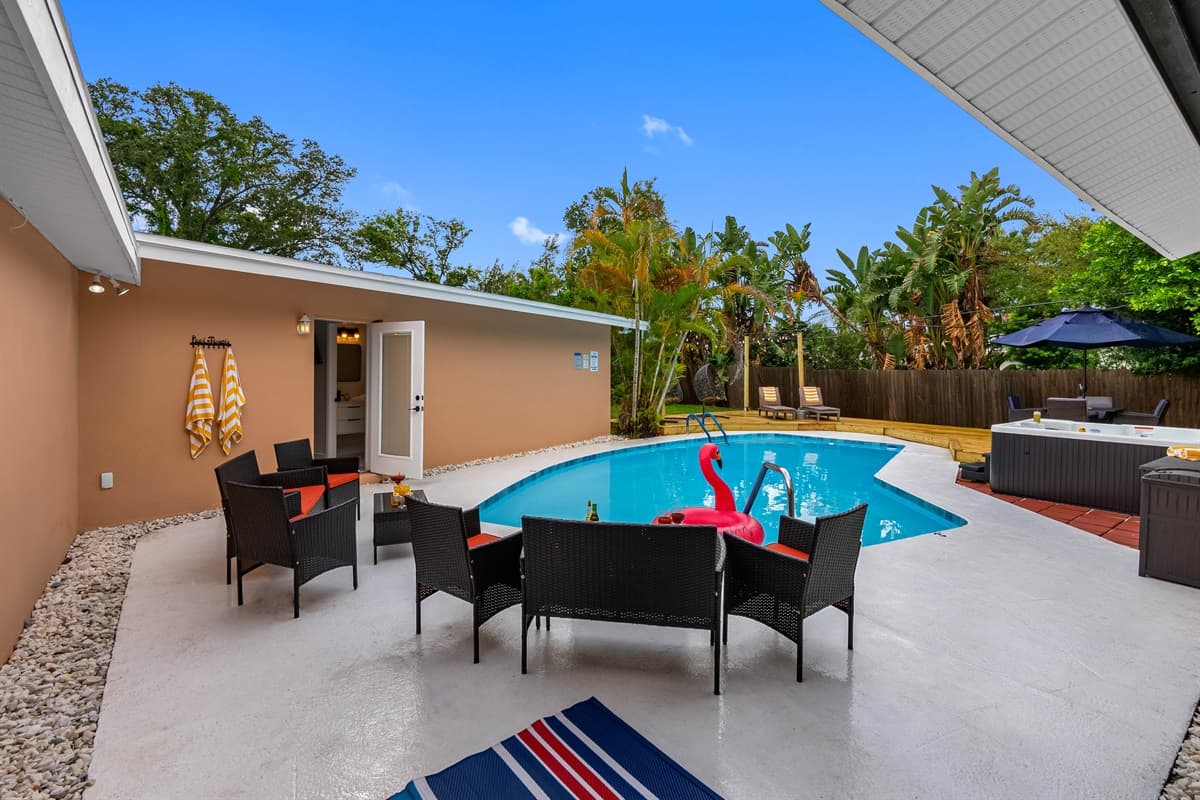 Step outside and discover a dreamy outdoor space—complete with a heated pool, spa, BBQ grill, and multiple lounging zones.