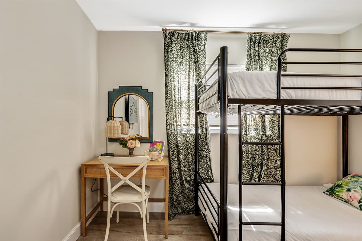 In this bedroom, flexibility and thoughtful design converge to create a welcoming environment that adapts to the unique needs of each guest.