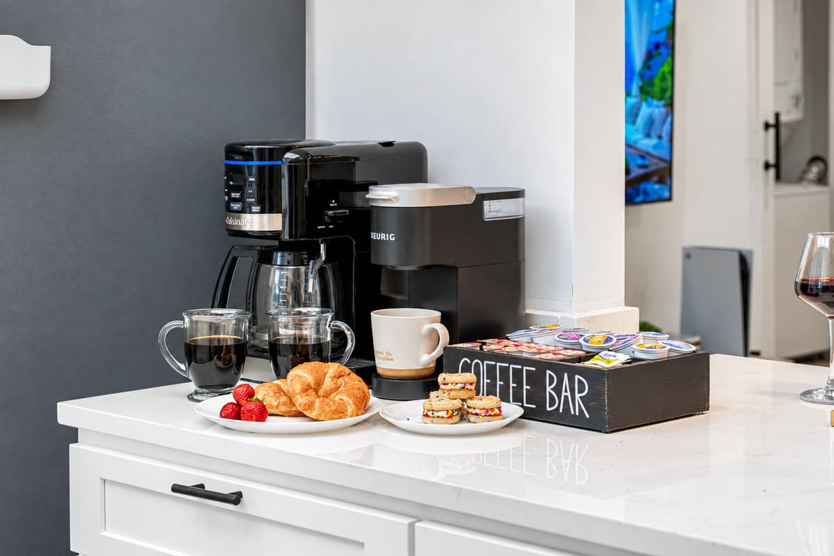 Start your day right with our deluxe coffee bar—complete with Keurig, drip machine, mugs, and K-cups.