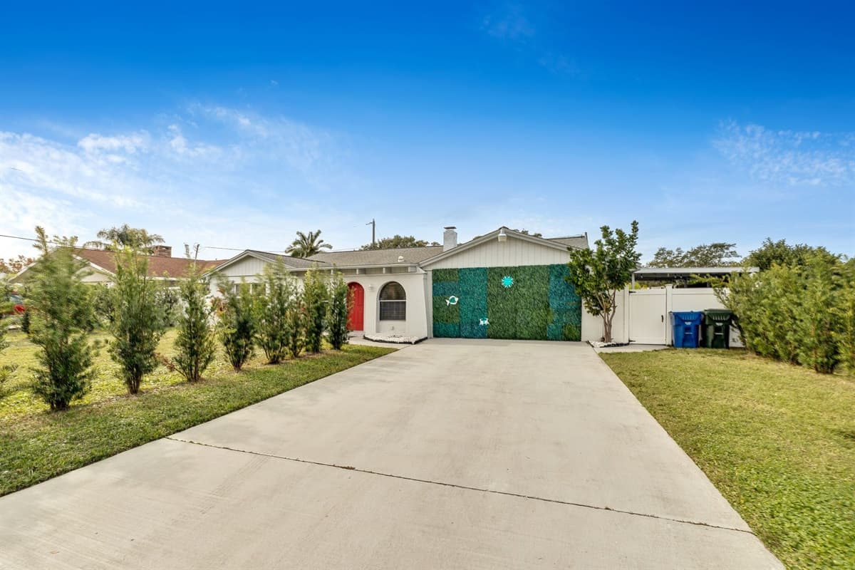 The grandeur of the design is complemented by an expansive driveway.