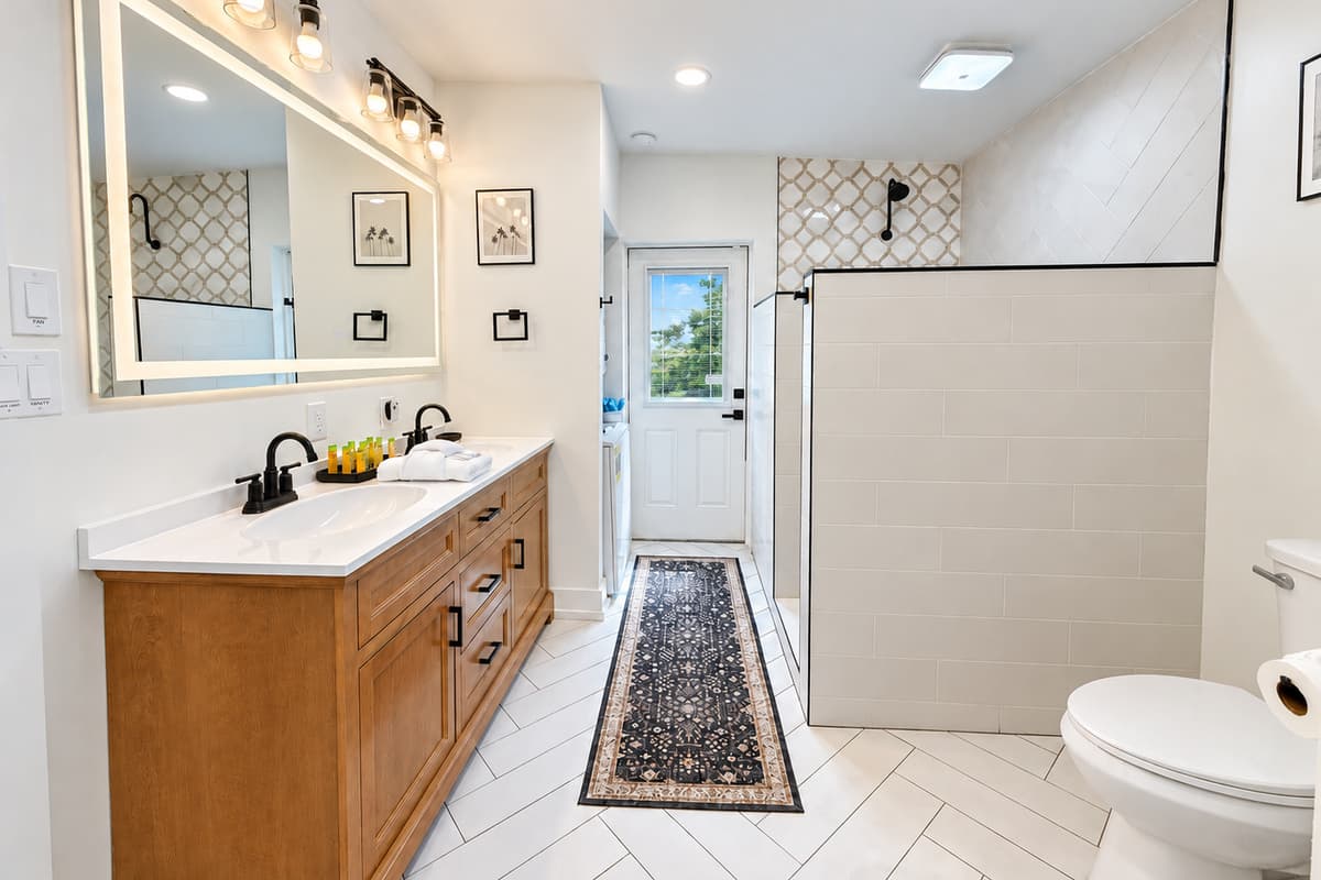 Bathroom 1 with a double vanity and walk-in shower.