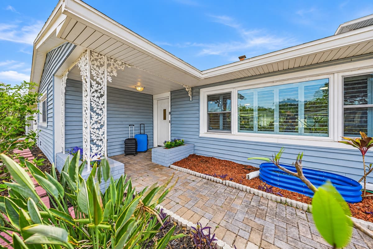 Front exterior view highlighting the home’s curb appeal, landscaping, and inviting design 