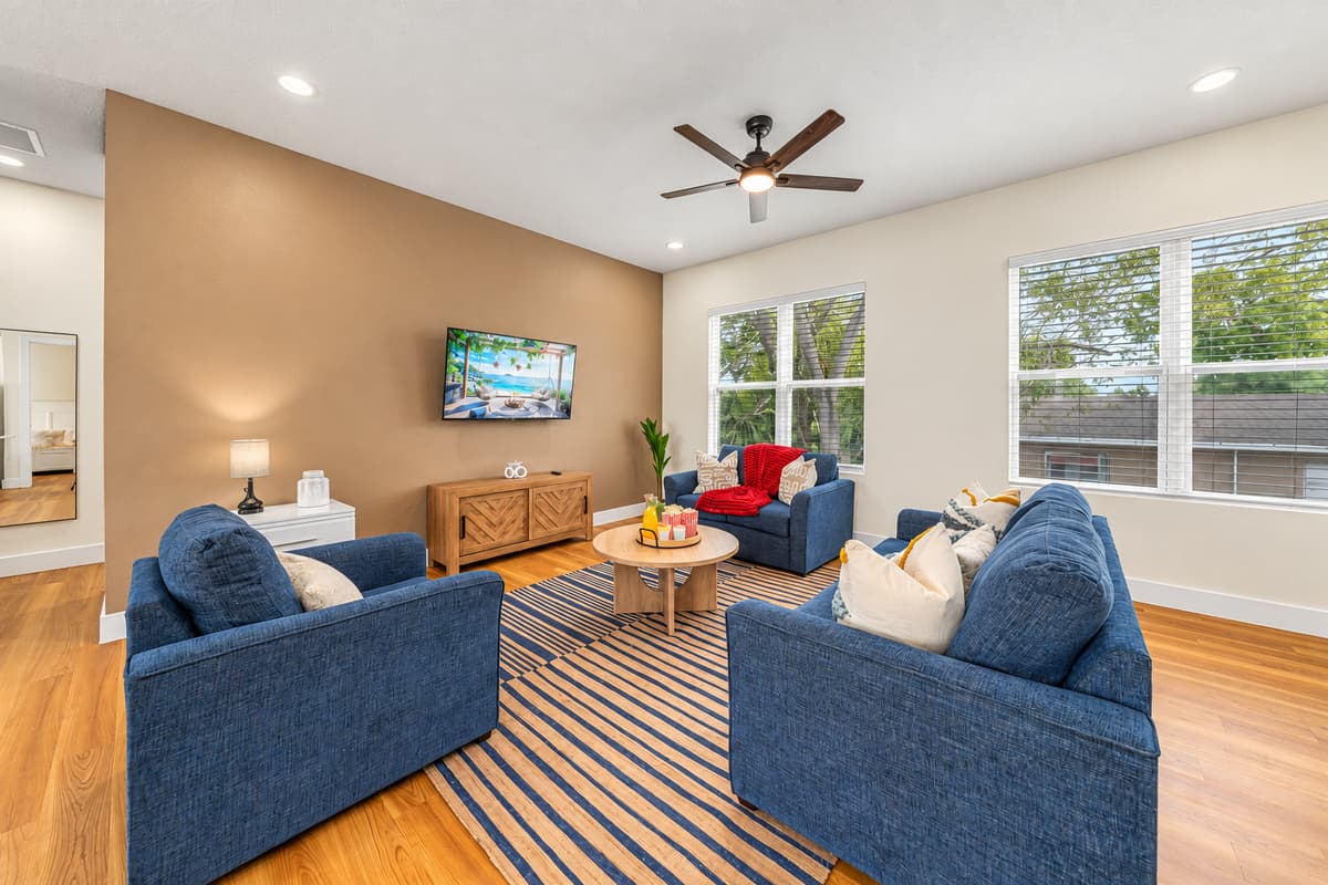 Stylish lounge area with plush seating and TV—perfect for movie nights and gatherings.