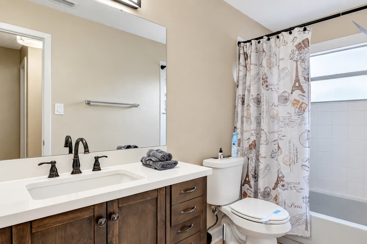 Our bathroom is a harmonious blend of luxury and functionality, featuring a tub and shower combination for the perfect bath-time balance.