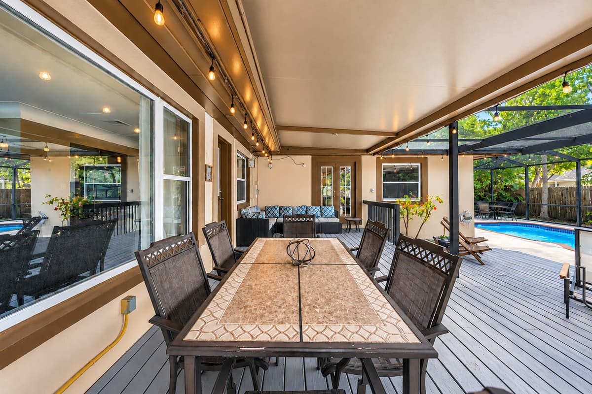 Relaxing patio setup with plenty of seating and peaceful backyard surroundings.