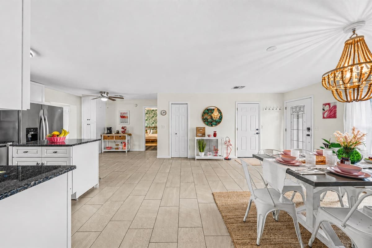 Wide view of the dining space connected to the kitchen—perfect for gatherings and shared meals.