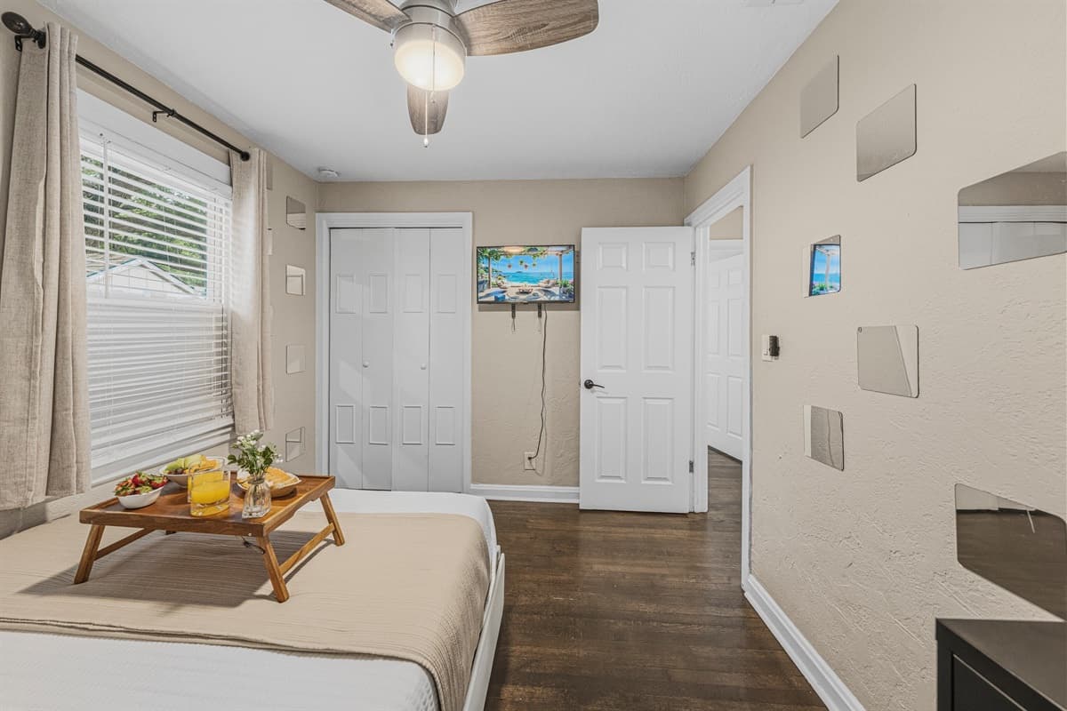 Spacious bedroom with cozy bed, seating area, and inviting ambiance for ultimate comfort.