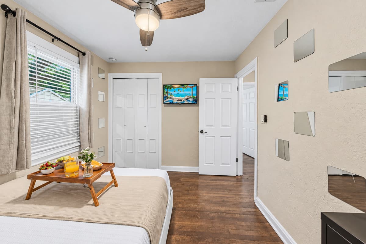 Spacious bedroom with cozy bed, seating area, and inviting ambiance for ultimate comfort.